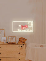 A Letter to Santa Playroom Merry Christmas Neon Sign by Neon.Shop with glowing LED lettering for kids’ holiday décor.