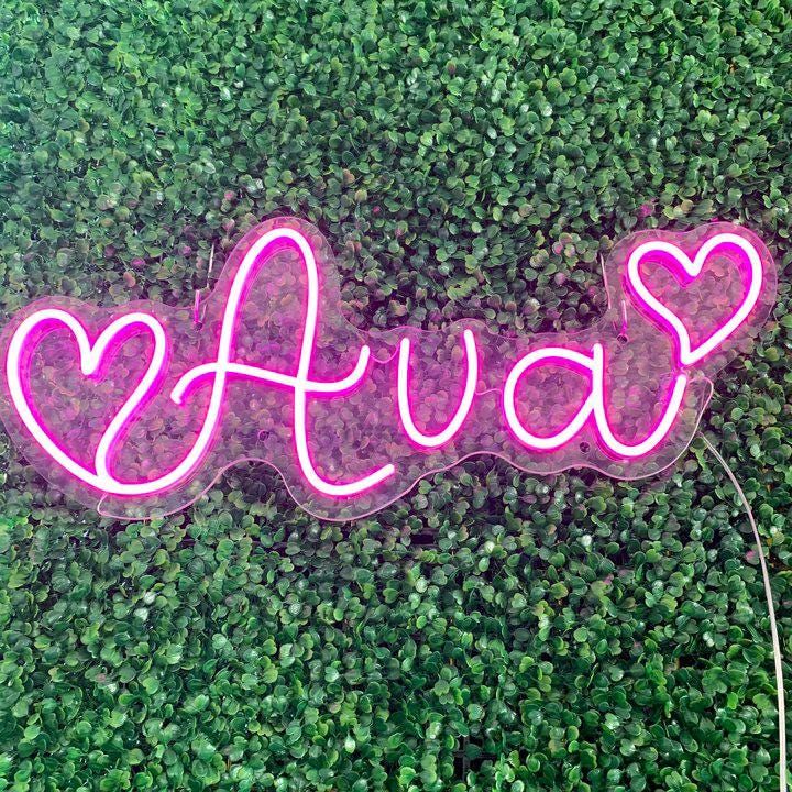 AVA LED Neon Name Sign by Neon.Shop adding vibrant LED glow to bedrooms, home offices, and living spaces.