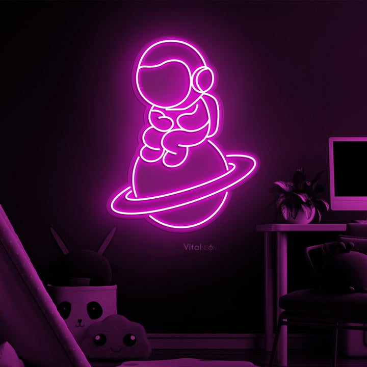 Baby Astronaut UV Art LED neon sign glowing on bedroom wall by Neon.Shop