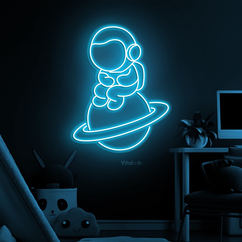 Baby Astronaut UV Art LED neon sign glowing on bedroom wall by Neon.Shop
