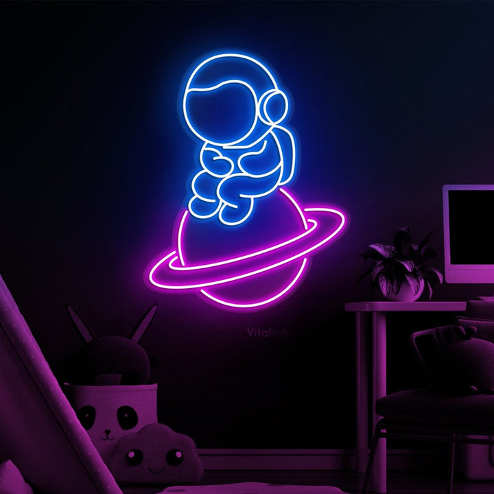Baby Astronaut UV Art LED neon sign glowing on bedroom wall by Neon.Shop