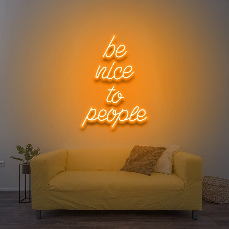 Be Nice To People” inspirational LED neon wall light, perfect for bedrooms, offices, or creative workspaces by Neon.Shop.