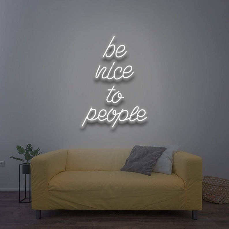 Be Nice To People” inspirational LED neon wall light, perfect for bedrooms, offices, or creative workspaces by Neon.Shop.
