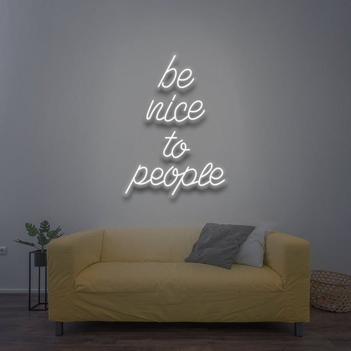 Be Nice To People” inspirational LED neon wall light, perfect for bedrooms, offices, or creative workspaces by Neon.Shop.