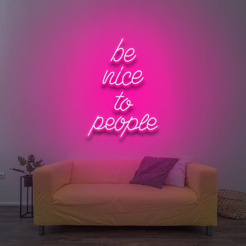 Be Nice To People” inspirational LED neon wall light, perfect for bedrooms, offices, or creative workspaces by Neon.Shop.
