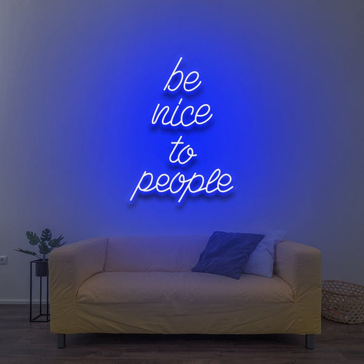 Be Nice To People” inspirational LED neon wall light, perfect for bedrooms, offices, or creative workspaces by Neon.Shop.