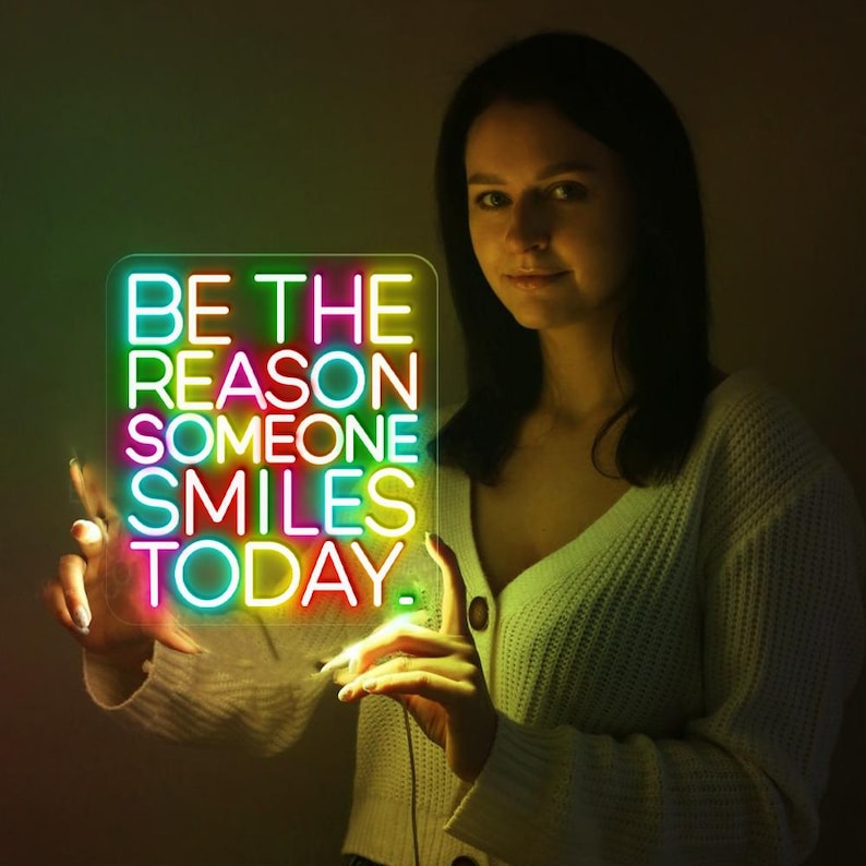 Be The Reason Someone Smiles Today neon sign glowing in bright LED colors by Neon.Shop