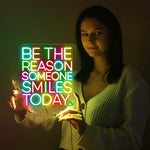 Be The Reason Someone Smiles Today neon sign glowing in bright LED colors by Neon.Shop