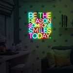Be The Reason Someone Smiles Today neon sign glowing in bright LED colors by Neon.Shop
