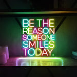 Be The Reason Someone Smiles Today neon sign glowing in bright LED colors by Neon.Shop