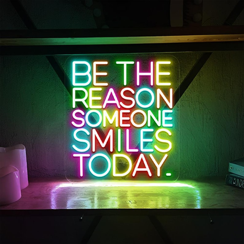 Be The Reason Someone Smiles Today neon sign glowing in bright LED colors by Neon.Shop
