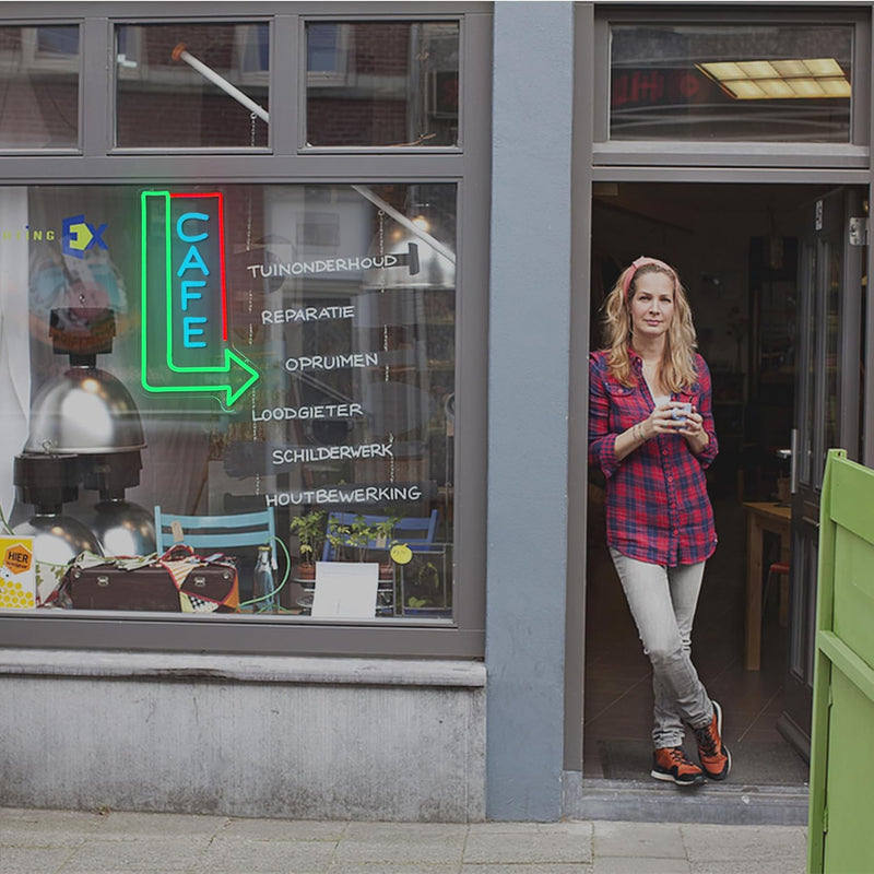 Cafe with Arrow LED neon sign by Neon.Shop mounted above a café entrance to attract foot traffic
