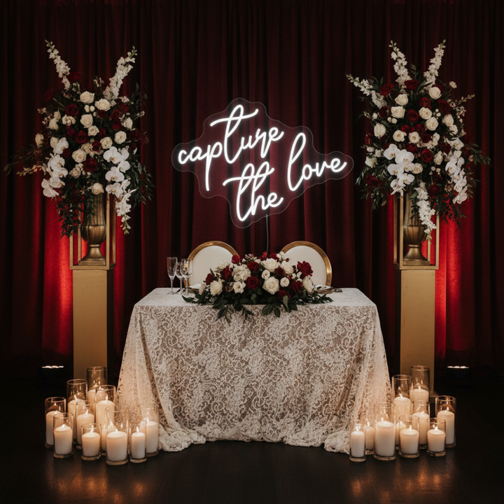 Capture the Love wedding LED neon sign glowing on photo booth backdrop – Neon.Shop