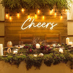 Cheers Wedding LED Neon Sign glowing at wedding bar by Neon.Shop