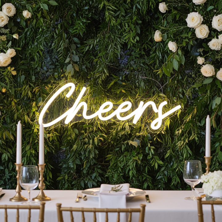 Cheers Wedding LED Neon Sign glowing at wedding bar by Neon.Shop
