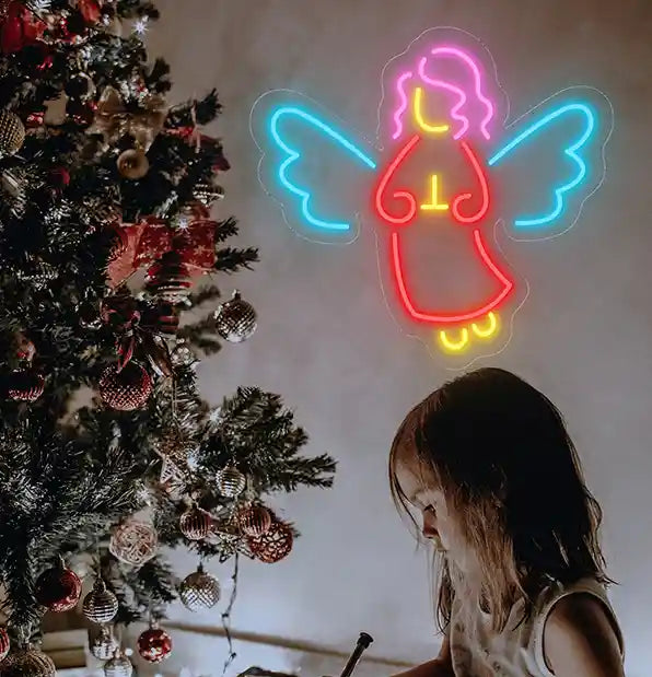Christmas Angel Merry Christmas Neon Sign by Neon.Shop featuring a glowing angel design for holiday décor.
