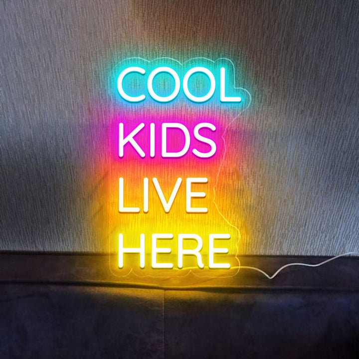 Cool Kids Live Here Neon Sign displayed in playroom or teen room by Neon.Shop