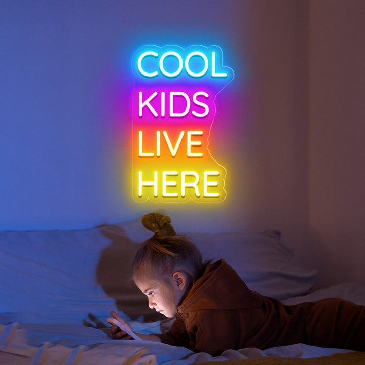 Cool Kids Live Here Neon Sign displayed in playroom or teen room by Neon.Shop
