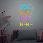 Cool Kids Live Here Neon Sign displayed in playroom or teen room by Neon.Shop