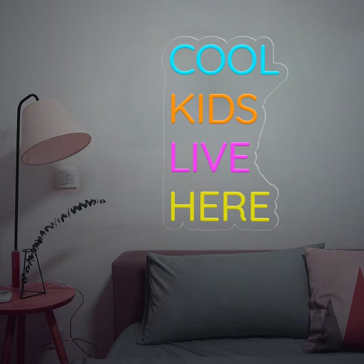 Cool Kids Live Here Neon Sign displayed in playroom or teen room by Neon.Shop