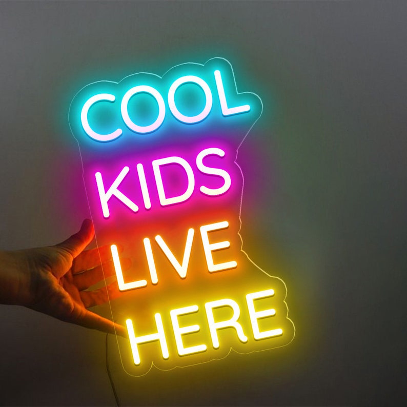 Cool Kids Live Here Neon Sign displayed in playroom or teen room by Neon.Shop