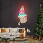 “Costumed Cat Merry Christmas Neon Sign by Neon.Shop featuring a glowing festive cat design for holiday décor.