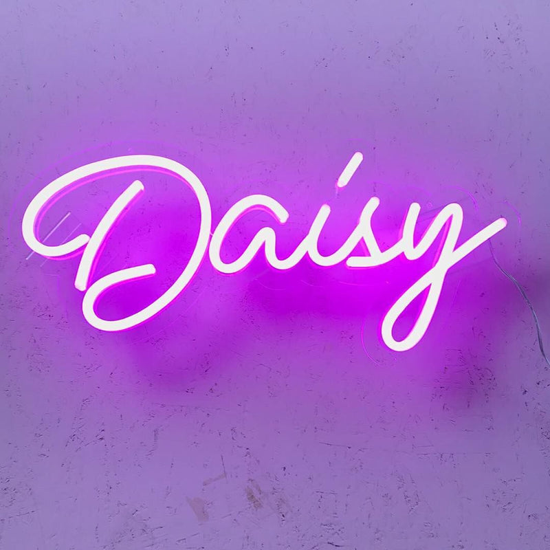 DAISY Name LED Neon Sign by Neon.Shop glowing brightly, custom LED name light for bedroom décor, nurseries, salons, parties, and personalized home styling.