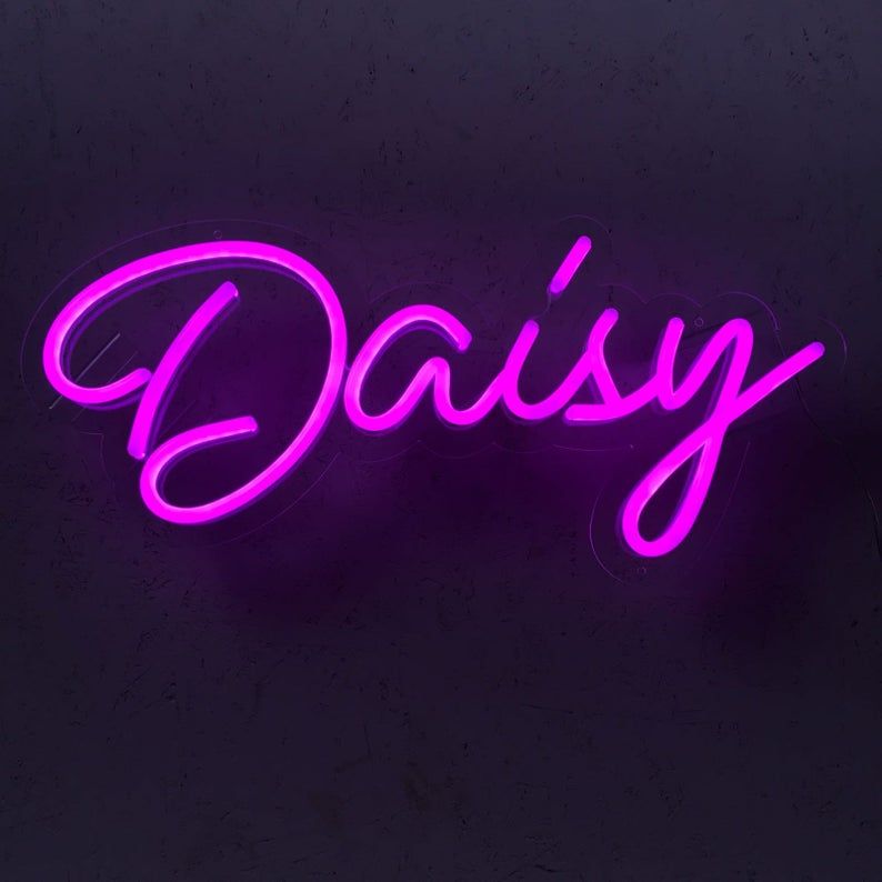 DAISY Name LED Neon Sign by Neon.Shop glowing brightly, custom LED name light for bedroom décor, nurseries, salons, parties, and personalized home styling.