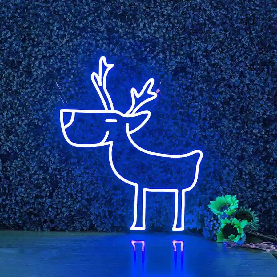 Deer Merry Christmas Neon Sign by Neon.Shop glowing in warm LED light on a festive holiday backdrop.