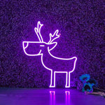 Deer Merry Christmas Neon Sign by Neon.Shop glowing in warm LED light on a festive holiday backdrop.