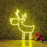 Deer Merry Christmas Neon Sign by Neon.Shop glowing in warm LED light on a festive holiday backdrop.