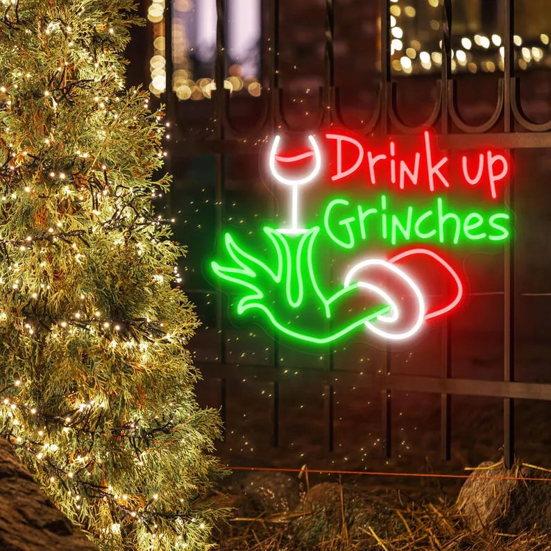 Drink Up Merry Christmas LED neon sign glowing in festive colors by Neon.Shop.