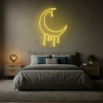 Dripping Moon LED neon sign by Neon.Shop glowing on a wall as artistic and celestial neon décor