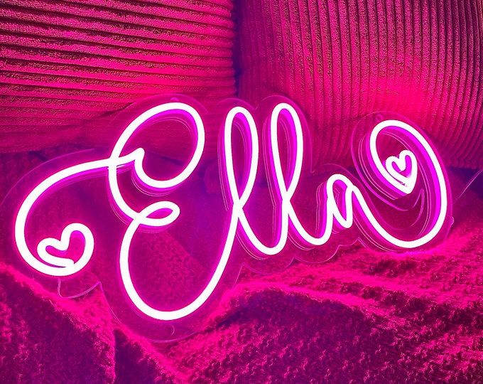 ELLA LED Neon Name Sign by Neon.Shop adding vibrant LED glow to bedrooms, home offices, and living spaces.