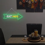Eat Here LED neon sign by Neon.Shop mounted outside a restaurant to attract foot traffic