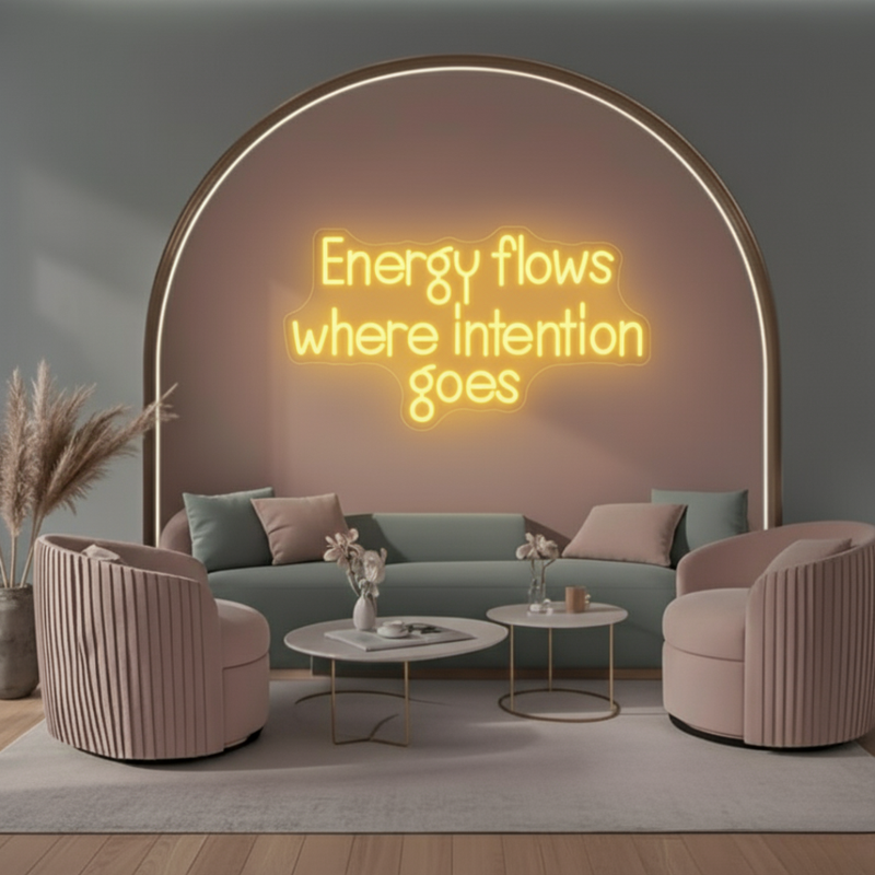Energy Flows Where Intention Goes” neon sign glowing on a wall, motivational quote décor for office, studio, or home by Neon.Shop.