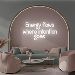 Energy Flows Where Intention Goes” neon sign glowing on a wall, motivational quote décor for office, studio, or home by Neon.Shop.