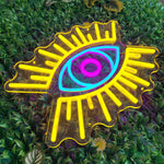Evil Eye LED neon sign by Neon.Shop glowing on a wall as modern, protective, and stylish neon décor