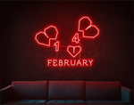 February” Valentine’s Day LED neon sign glowing in warm pink and red tones, perfect for love-themed décor by Neon.Shop
