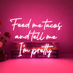 Feed Me Tacos And Tell Me I Am Pretty LED neon sign glowing brightly, perfect for kitchens, dining areas, and playful home décor by Neon.Shop