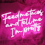 Feed Me Tacos And Tell Me I Am Pretty LED neon sign glowing brightly, perfect for kitchens, dining areas, and playful home décor by Neon.Shop