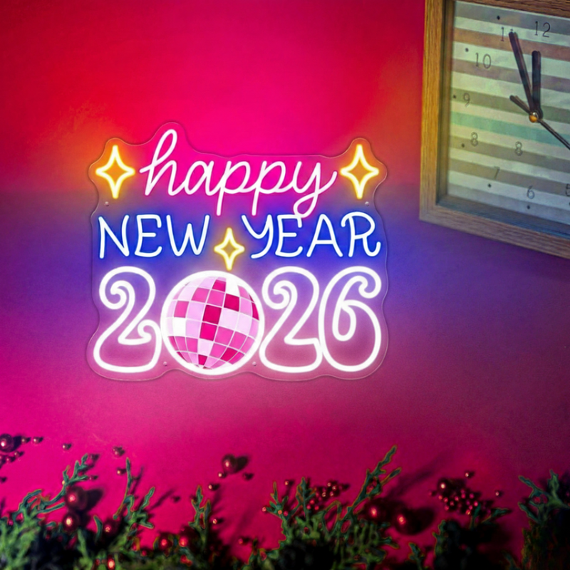 'Happy New Year 2026' neon sign surrounded by disco balls and silver tinsel, presented by Neon.Shop.