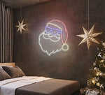 Hipster Santa Merry Christmas LED neon sign glowing in festive colors by Neon.Shop.