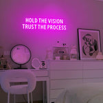 Hold The Vision, Trust The Process neon sign glowing in vibrant LED colors by Neon.Shop