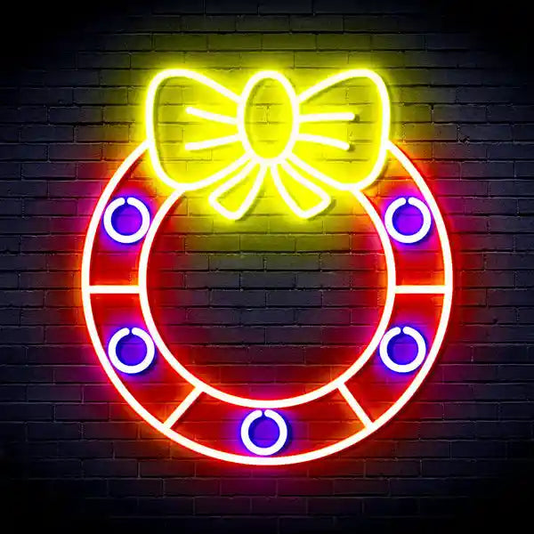 Holly Wreath with Ribbon Bow Merry Christmas Neon Sign by Neon.Shop glowing in festive LED light with wreath and ribbon bow design.