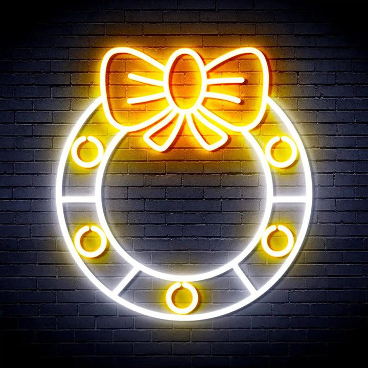Holly Wreath with Ribbon Bow Merry Christmas Neon Sign by manhattanneons.com - Add a festive touch to your décor with this holly wreath neon sign.