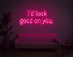 I’d Look Good On You” Valentine’s Day LED neon sign glowing in playful pink and red tones, perfect for romantic décor by Neon.Shop