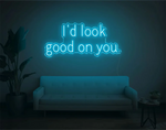 I’d Look Good On You” Valentine’s Day LED neon sign glowing in playful pink and red tones, perfect for romantic décor by Neon.Shop 
