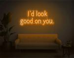 I’d Look Good On You” Valentine’s Day LED neon sign glowing in playful pink and red tones, perfect for romantic décor by Neon.Shop