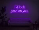 I’d Look Good On You” Valentine’s Day LED neon sign glowing in playful pink and red tones, perfect for romantic décor by Neon.Shop